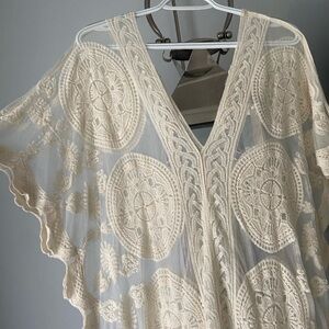 Hand Made Lace Cover up for holiday’s or vail even into a wedding. ect